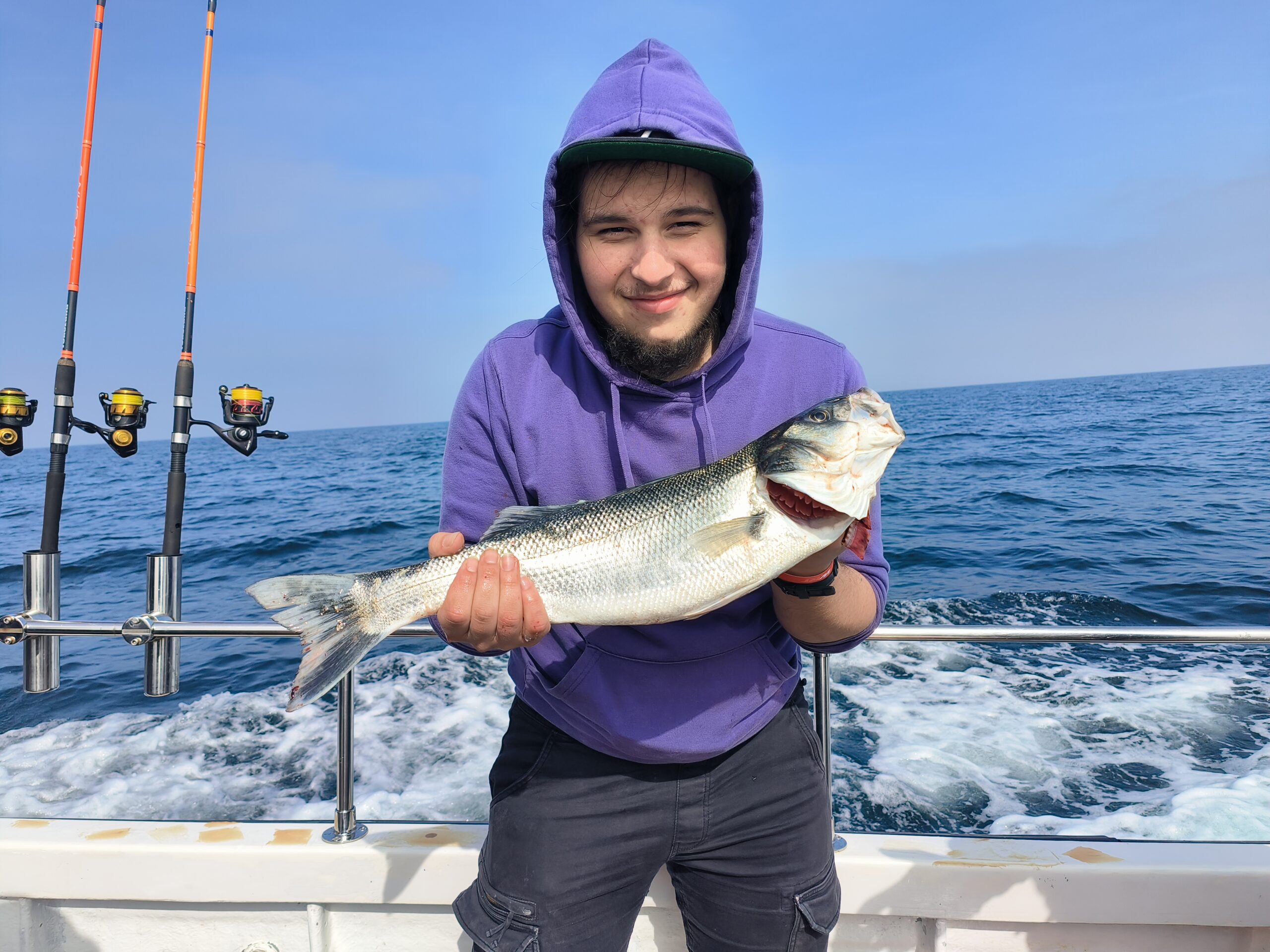 Young Angler and sea bass